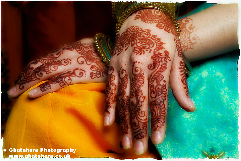 IMG6873 
 Henna covered hands placed on the knees. Henna by Kiran Chana, Ray of light. 
 Keywords: Henna covered hands placed on the knees. Henna, mendhi, designs, wedding, indian bride, hands, patterns, fashion, body art, tattoo, hands, colour, wedding, make-up, Bhupinder Ghatahora, Ghatahora Photography